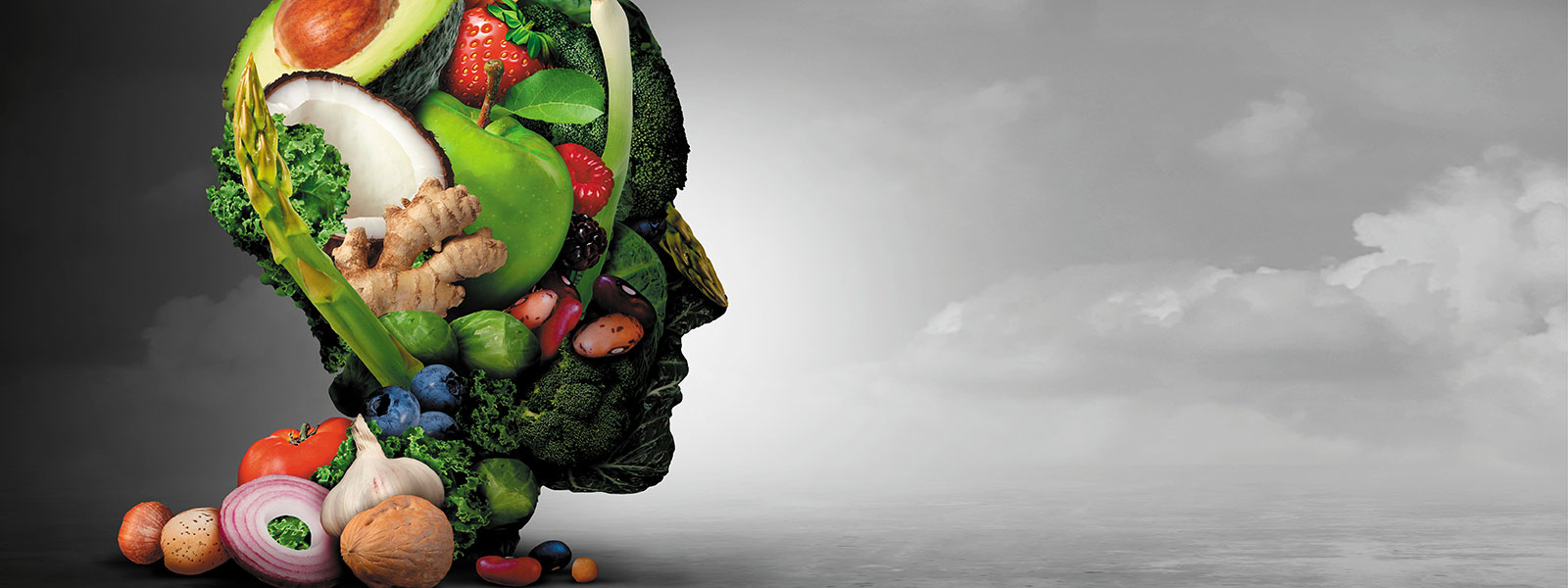 Ein Kopf als Kunstwerk, gefüllt mit verschiedenen Gemüsesorten und Früchten